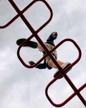 LOW ANGLE VIEW OF BASKETBALL AGAINST SKY