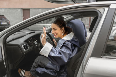 Smiling woman in car