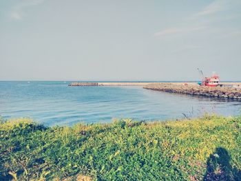 Scenic view of sea against clear sky