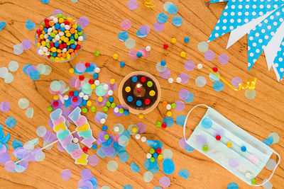 High angle view of multi colored candies on table