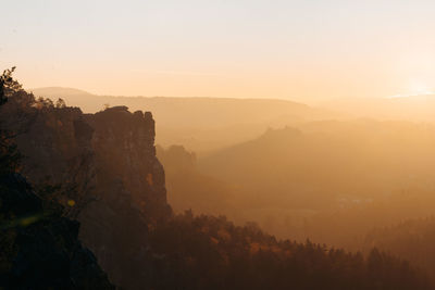 Scenic view of mountains against sky during sunset