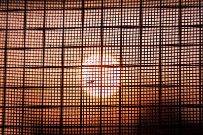 Full frame shot of metal grate window in building