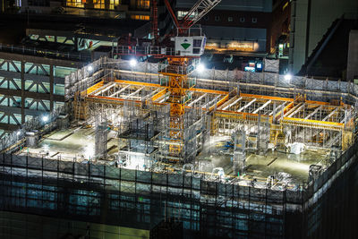 High angle view of illuminated buildings in city