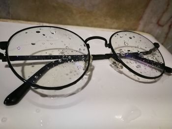 Close-up of eyeglasses on water