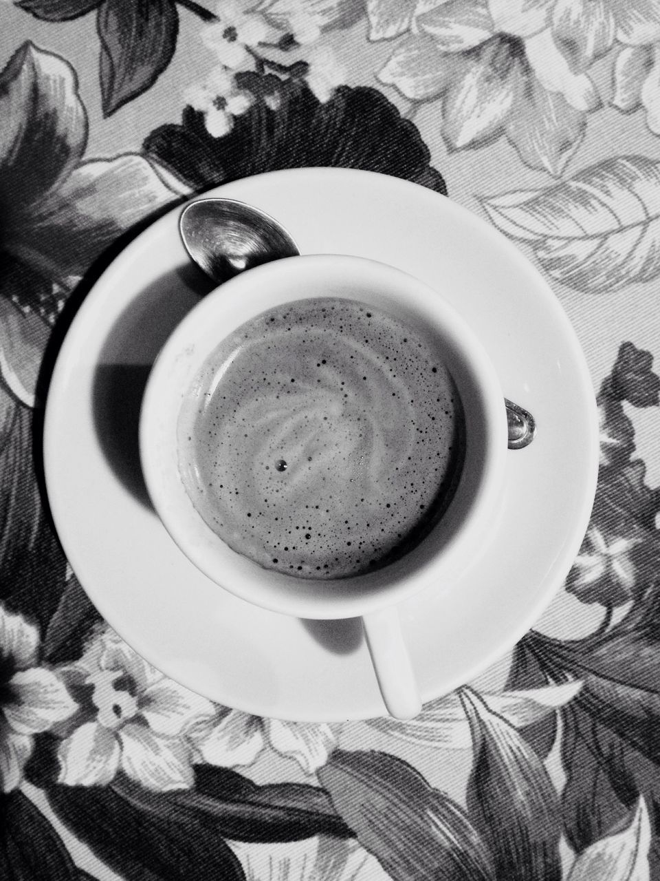 coffee cup, coffee - drink, refreshment, saucer, cup, freshness, still life, directly above, coffee, tea cup, close-up, breakfast, overhead view, no people, black coffee, beverage, tablecloth, empty, elevated view, serving size