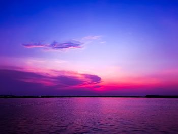 Scenic view of sea against romantic sky at sunset