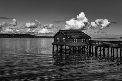 House by sea against sky