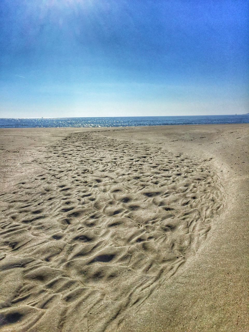 sand, beach, nature, sea, tranquility, scenics, sunlight, beauty in nature, sky, horizon over water, tranquil scene, day, no people, outdoors, water