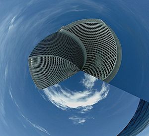 Low angle view of modern building against blue sky
