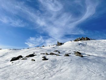 Cliffs in the snow on a sunny day with blue sky