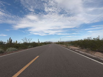 Empty road against sky