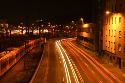 High angle view of light trails on road at night