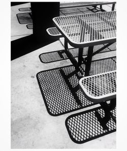 High angle view of chairs on table