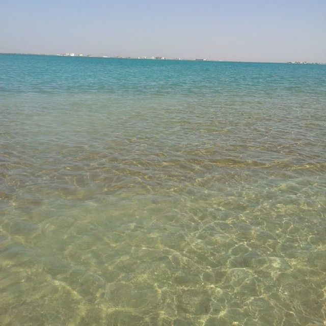 water, sea, tranquility, tranquil scene, waterfront, scenics, beauty in nature, rippled, nature, horizon over water, idyllic, clear sky, blue, sky, day, outdoors, no people, beach, remote, sunlight