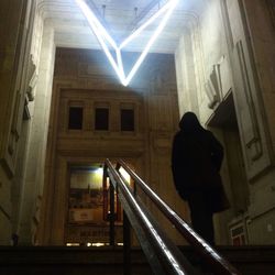 Woman standing against wall