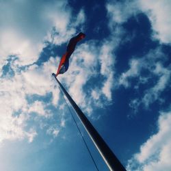 Low angle view of bird flying against sky