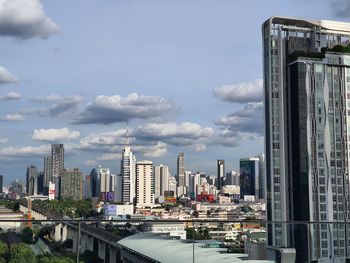 Modern buildings in city against sky