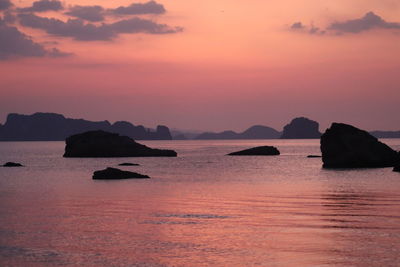 Scenic view of sea against romantic sky at sunset