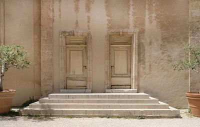 Steps leading to two doors of an old building in marseille