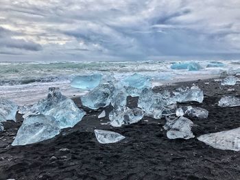 Scenic view of sea against dramatic sky