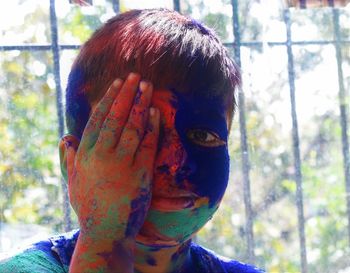 Close-up portrait of boy wearing hat outdoors