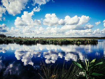 Reflection of clouds in calm lake
