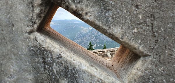 View of wall through window