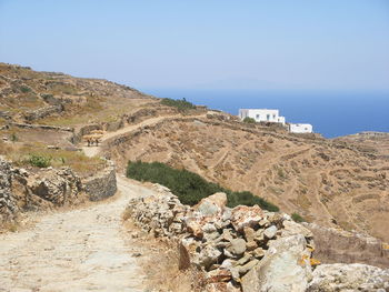 Scenic view of sea and mountains against clear sky