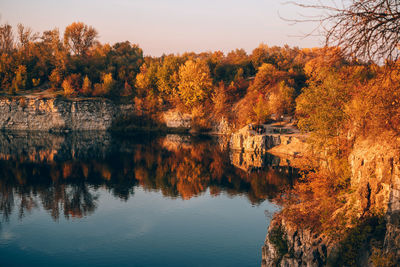 Scenic view of lake by trees during autumn