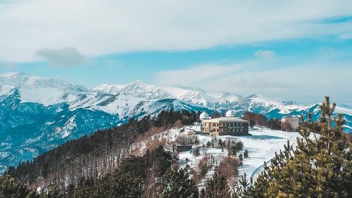 Scenic view of snowcapped mountains against sky