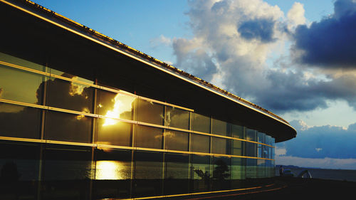 Low angle view of building against sky at sunset