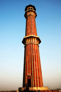 Low angle view of jami masjid minaret against clear sky