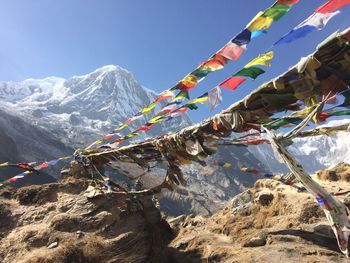 Low angle view of ropes on mountain against clear sky