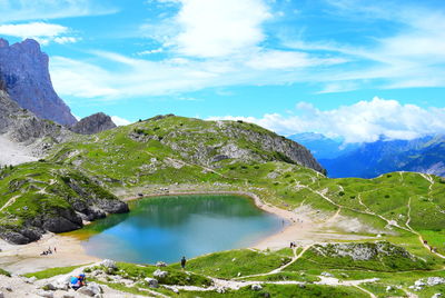 Scenic view of lake and mountains against sky