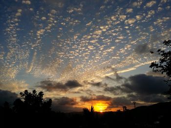 Scenic view of cloudy sky at sunset