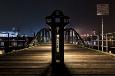 View of illuminated bridge against sky at night