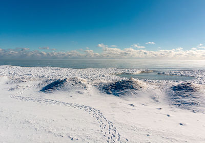 Scenic view of sea against sky during winter