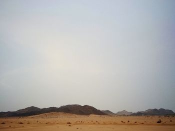 Scenic view of desert against clear sky