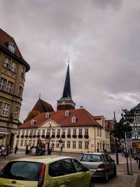 View of buildings in city against sky