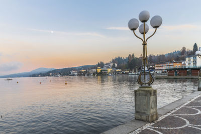 Last lights of the sunset in velden. reflections on the water and christmas atmosphere. austria.