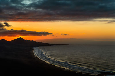 Scenic view of sea against sky during sunset. playa de cofete and jandia hills 