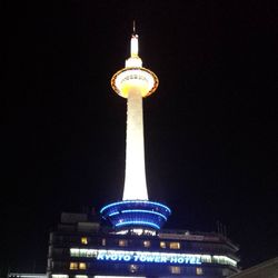 Low angle view of communications tower at night