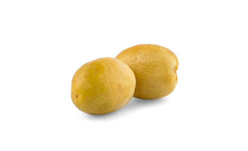 Close-up of oranges against white background