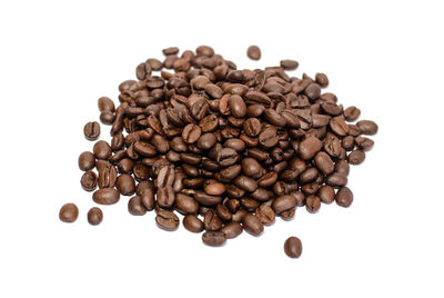 Directly above shot of coffee beans against white background