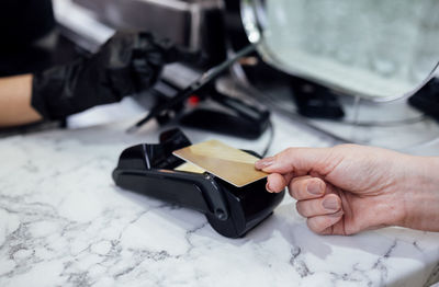 Cropped hand of person repairing car