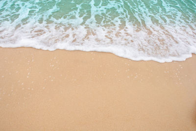 High angle view of surf on beach