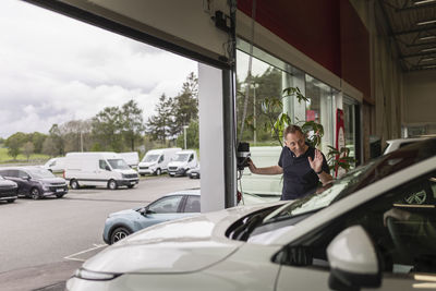 Customer leaving car dealership office