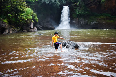 Full length of boy in water