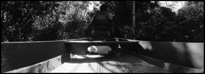 Rear view of man walking on walkway