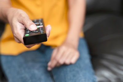 Close-up of man using mobile phone